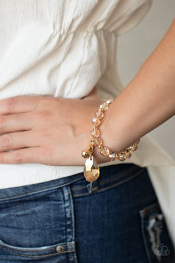 Gold bead and tassel bracelet